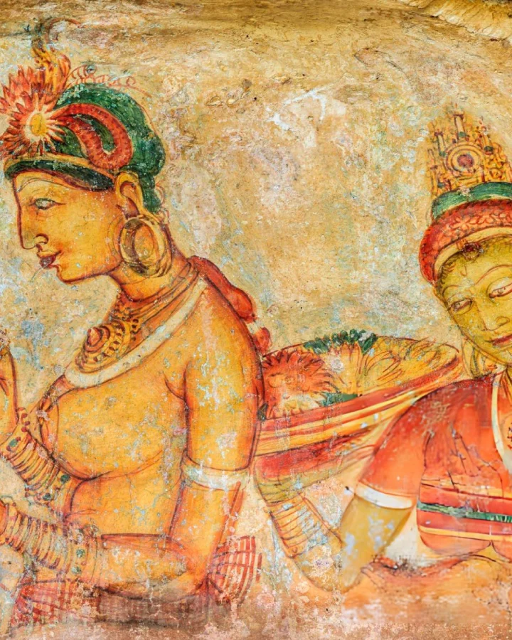 close-up of centuries-old sigiriya frescoes painted on the sheltered rock wall