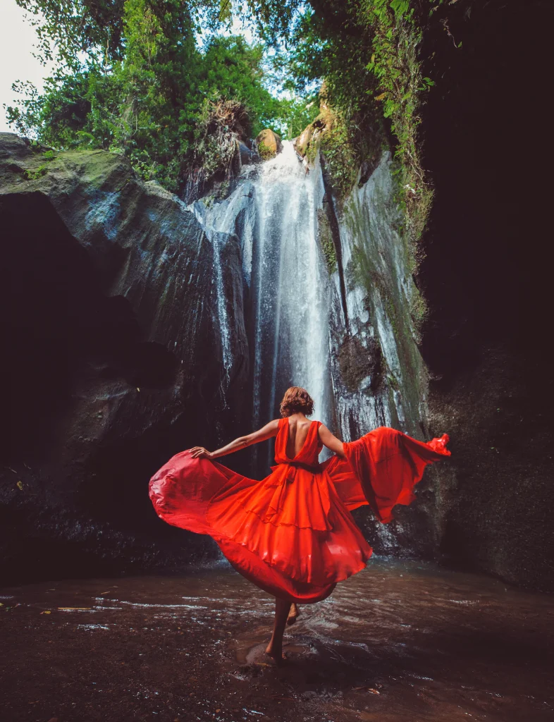 girl-red-dress-dancing-waterfall-sri-lanka