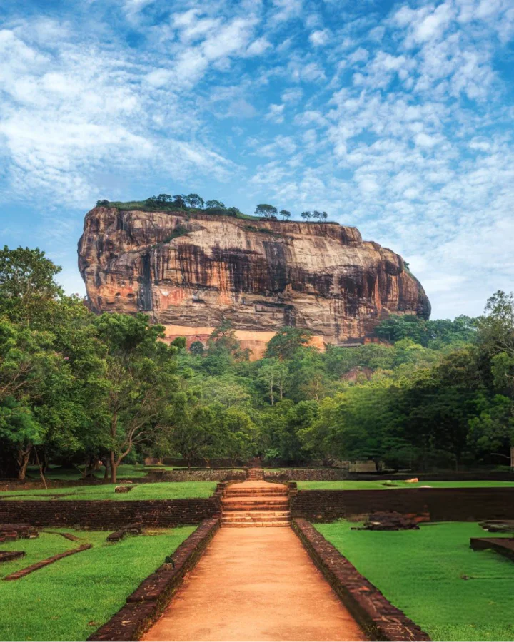 sigiriya monolith rising above the royal gardens and central pathway