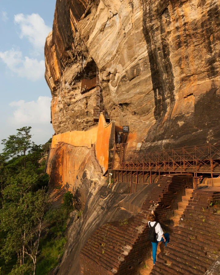 stone stairway built into the cliff face to apsara fresco