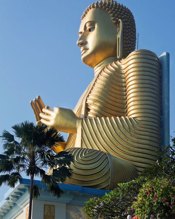Giant golden Buddha statue at Dambulla Golden Temple, Sri Lanka