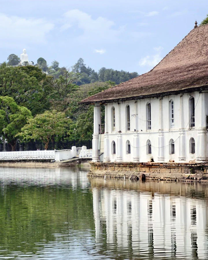 Temple building reflected in Kandy Lake near the Temple of the Sacred Tooth Relic